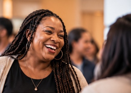 Smiling woman welcoming a guest at Faith Fellowship