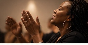 Woman lifting her hands in worship and prayer