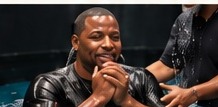 Man rejoicing at his baptism